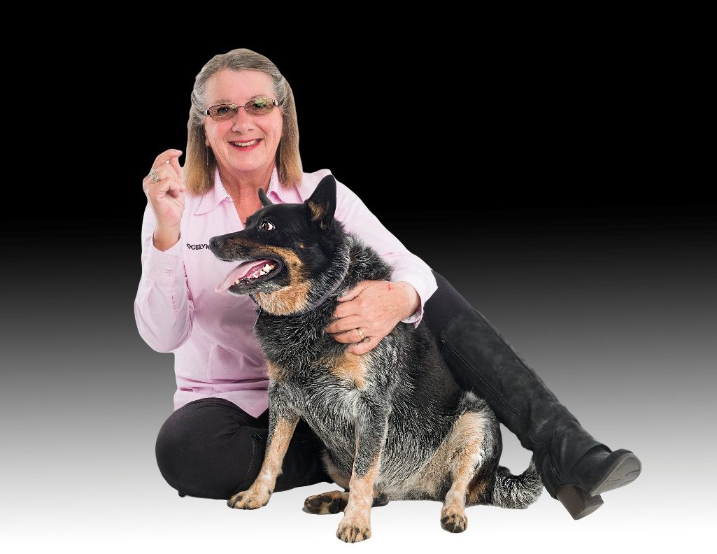Jocelyne Melton smiling beside her dog